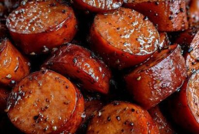 Thumbnail for Slow Cooker Spicy Sriracha Kielbasa Bites