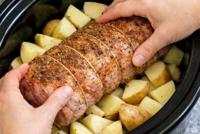 Thumbnail for Place pork loin roast onto potatoes, together with 3 simple ingredients, into slow cooker for a hearty dinner that disappears faster than anything else