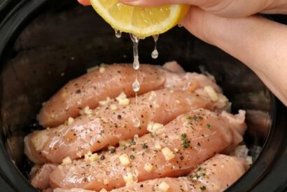 Thumbnail for Squeeze lemon juice over raw chicken tenderloins, paired with 2 simple ingredients, into slow cooker for an easy springtime dish that I crave week after week.