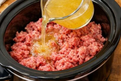 Thumbnail for Pour chicken broth over ground beef, plus 3 ingredients, into slow cooker for a creamy meal that’s the one everyone asks for