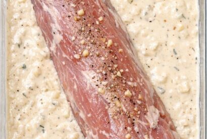 Thumbnail for Place raw pork tenderloin in the glass casserole dish and 3 other ingredients to get a meal so delicious your husband will be begging for more.