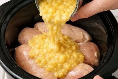Thumbnail for Dump cream style corn over chicken breists, along with 2 ingredients, into slow cooker