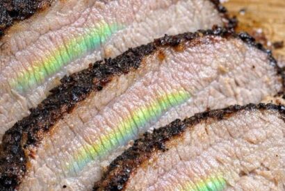 Thumbnail for I slow cooked a pork roast for 8 hours, but when I sliced it, I saw this weird shiny green and rainbow reflection on the meat fibers. It looks like ga.