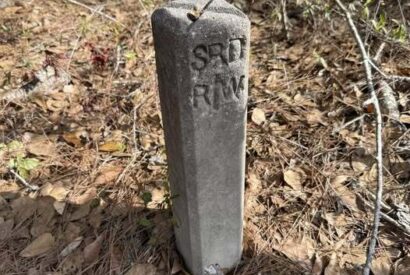 Thumbnail for What’s Hiding Beside This Quiet Path? The Small Concrete Marker That Reveals a Forgotten Road and a Piece of Local History