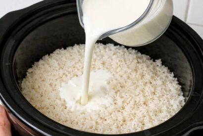 Thumbnail for Pour whole milk over raw white rice, paired with 4 ingredients, into slow cooker for a comforting dessert that’s my default when I don’t know what to make