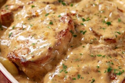 Thumbnail for Smothered Pork Chops with Potatoes in Gravy