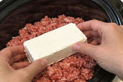 Thumbnail for Place cream cheese block atop raw ground beef, along with 2 ingredients, into slow cooker for a hearty weeknight dinner that’s always an absolute yes