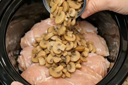 Thumbnail for Dump canned sliced mushrooms over raw chicken breasts, together with 3 ingredients, into slow cooker for a savory supper that’s my default when I don’
