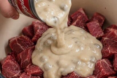 Thumbnail for Layer canned cream of mushroom soup and these 3 ingredients over cubed beef chuck into a dutch oven for a hearty dinner that brings everyone back to t